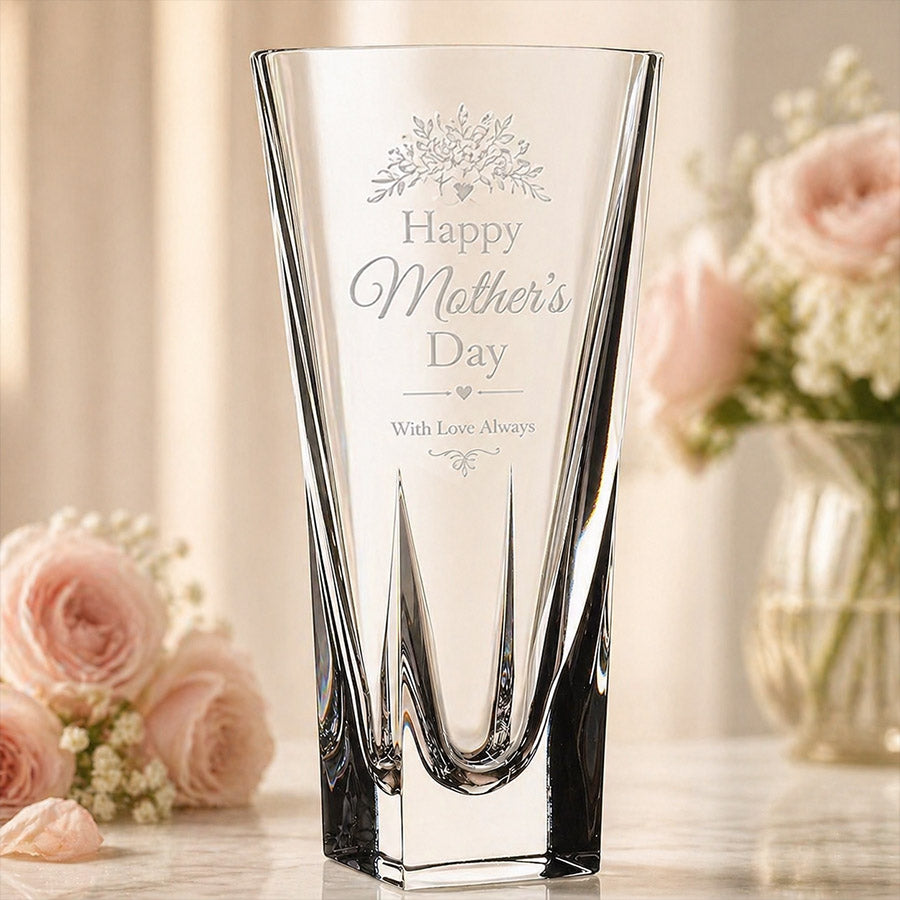 Engraved crystal vase with Happy Mother’s Day message, floral accents, and soft pink rose display background -- lxi-context:mothers-day