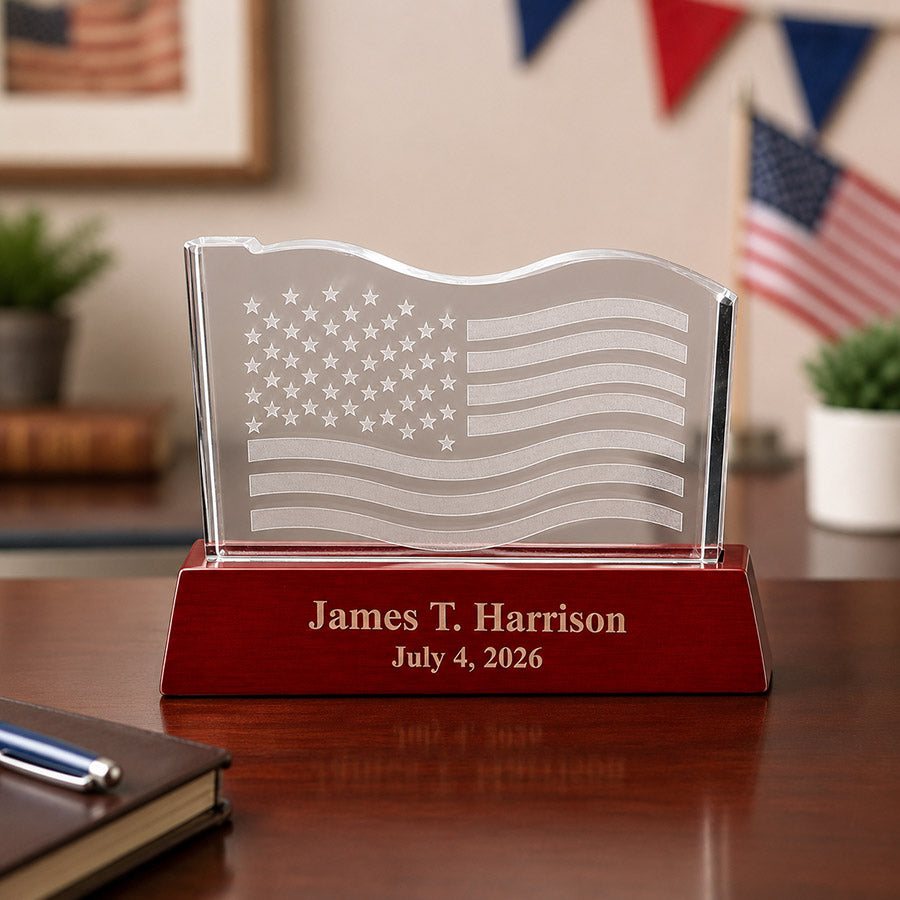 Personalized wavy crystal American flag award with engraved James T. Harrison name and July 4, 2026 date on a wood base -- lxi-context:4th-of-july