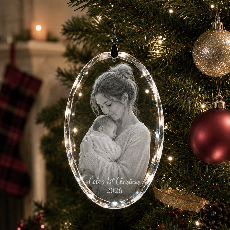 Personalized oval crystal Christmas ornament with engraved mother and newborn photo, Cole’s 1st Christmas message, and 2026 date -- lxi-context:christmas