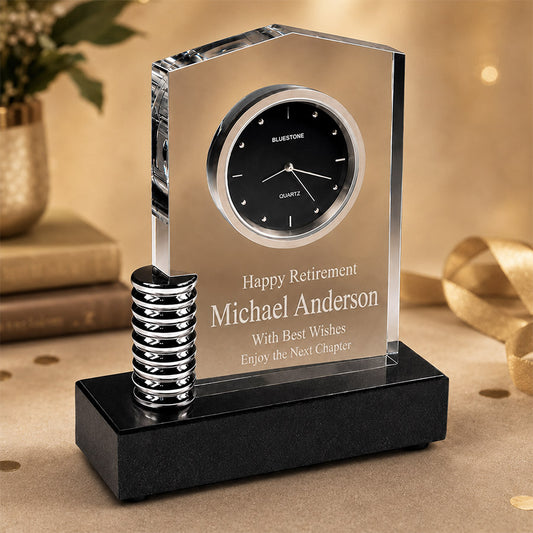 Personalized crystal desk clock with metal accent, black base, Happy Retirement message, and Michael Anderson name -- lxi-context:retirement