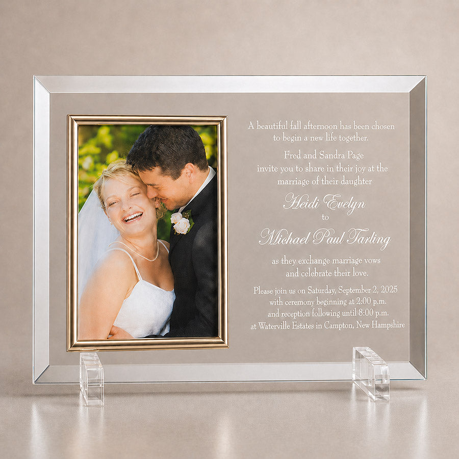 Personalized glass photo frame with wedding couple picture and engraved wedding invitation text on a neutral display background -- lxi-context:wedding
