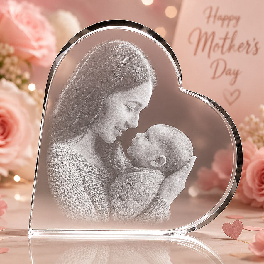 Personalized heart-shaped crystal keepsake with engraved mother and baby photo in a soft Mother’s Day floral setting -- lxi-context:mothers-day