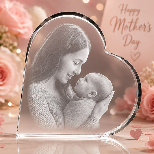 Personalized heart-shaped crystal keepsake with engraved mother and baby photo in a soft Mother’s Day floral setting -- lxi-context:mothers-day