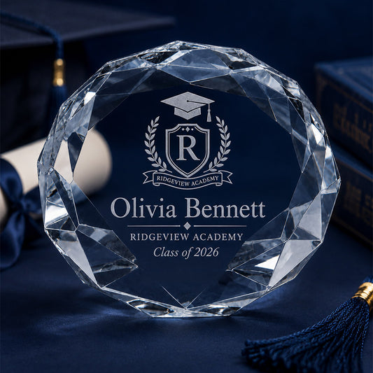 Graduation-themed faceted crystal paperweight engraved with Ridgeview Academy crest, Olivia Bennett, Ridgeview Academy, and Class of 2026 -- lxi-context:graduation