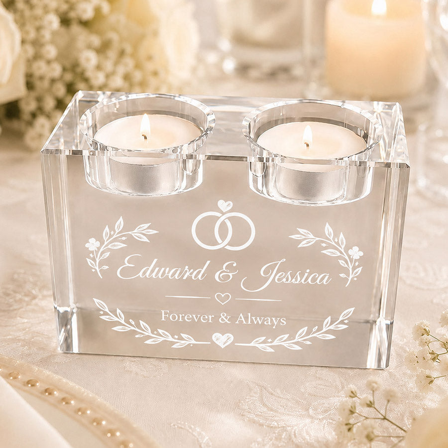 Engraved crystal double tealight candle holder with two lit candles, personalized with wedding rings, “Edward & Jessica,” and “Forever & Always,” displayed in an elegant wedding setting -- lxi-context:wedding