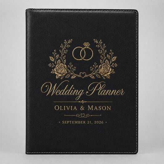 Personalized black leatherette portfolio with gold wedding planner design, floral accents, couple names, and wedding date -- lxi-context:wedding