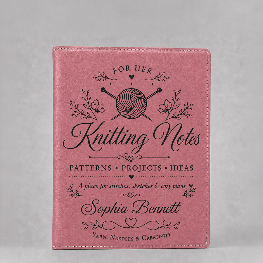 Personalized pink leatherette portfolio with black Knitting Notes design, yarn and needle graphic, floral accents, and custom name -- lxi-context:for-her