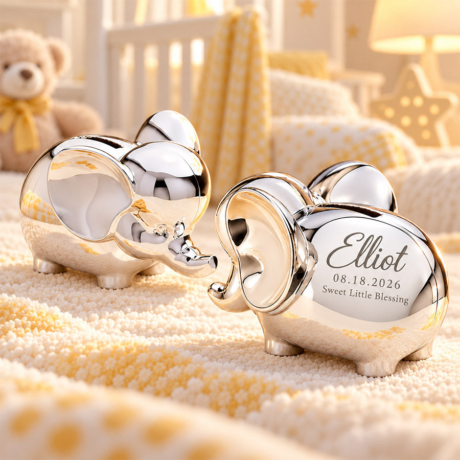 Personalized silver elephant keepsake pair with engraved Elliot name, birth date, and Sweet Little Blessing message in a soft yellow nursery setting -- lxi-context:for-baby -- lxi-context:new-baby